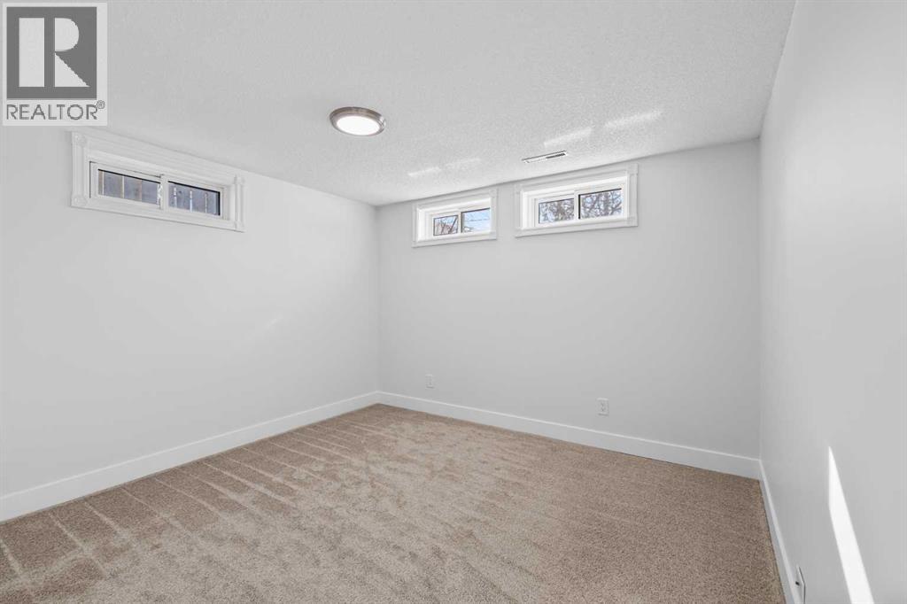 1007 Hunterston Place Nw, Calgary, Alberta  T2K 4N5 - Photo 32 - A2287224