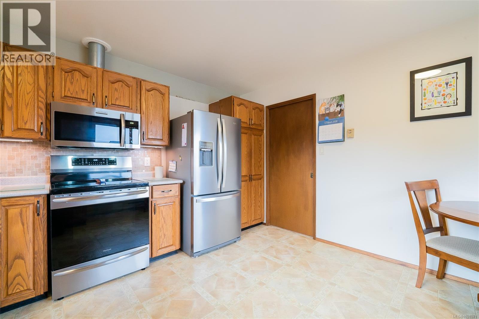 6243 Sechelt Dr, Nanaimo, British Columbia  V9V 1C6 - Photo 5 - 1028371