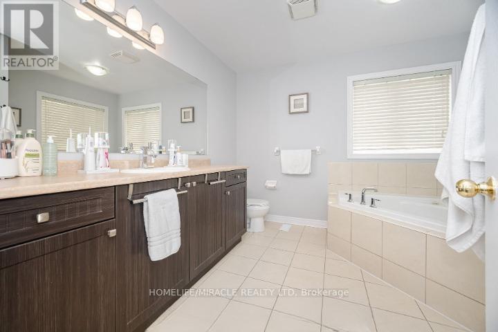 25 Baby Pointe Trail, Brampton, Ontario  L7A 0W3 - Photo 7 - W12878632