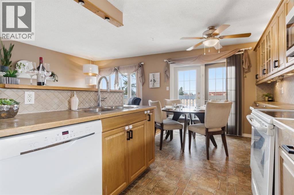 6605 Huntridge Hill Ne, Calgary, Alberta  T2K 4A1 - Photo 5 - A2292144