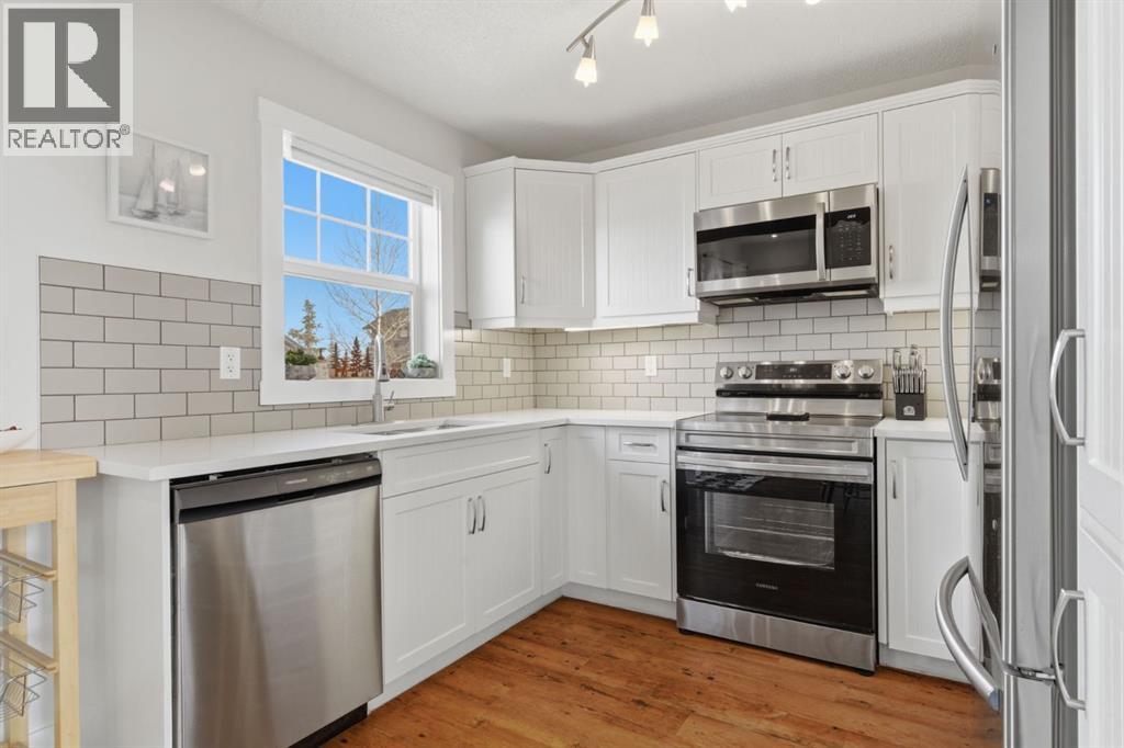 212 Cottageclub Crescent, Rural Rocky View County, Alberta T2K 1B3 - Photo 4 - A2291790