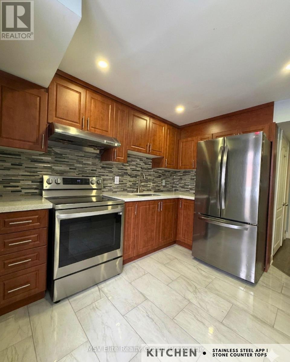 140 Queen Mary Drive, Brampton (Fletcher's Meadow), Ontario  L7A 2R5 - Photo 6 - W12886302