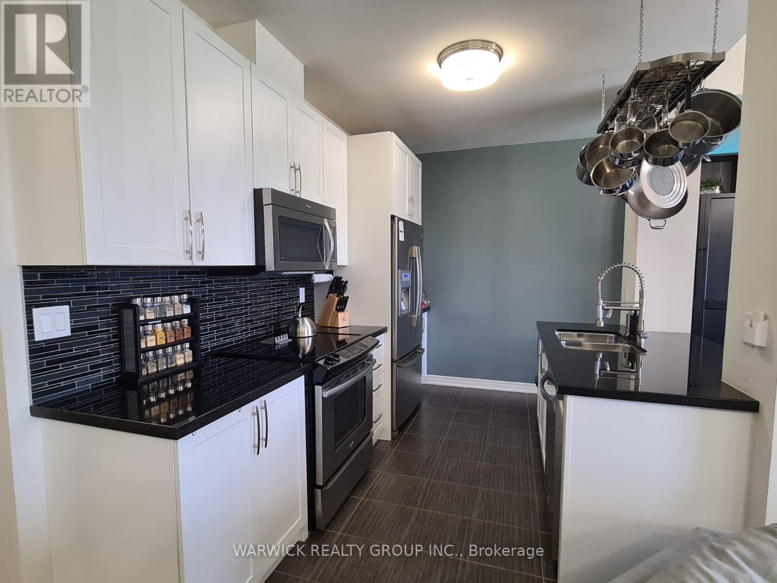 605 - 1419 Costigan Road, Milton, Ontario  L9T 0Y7 - Photo 3 - W12892572