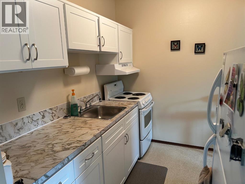 447 Huntsville Crescent Nw, Calgary, Alberta  T3K 4W3 - Photo 23 - A2293800