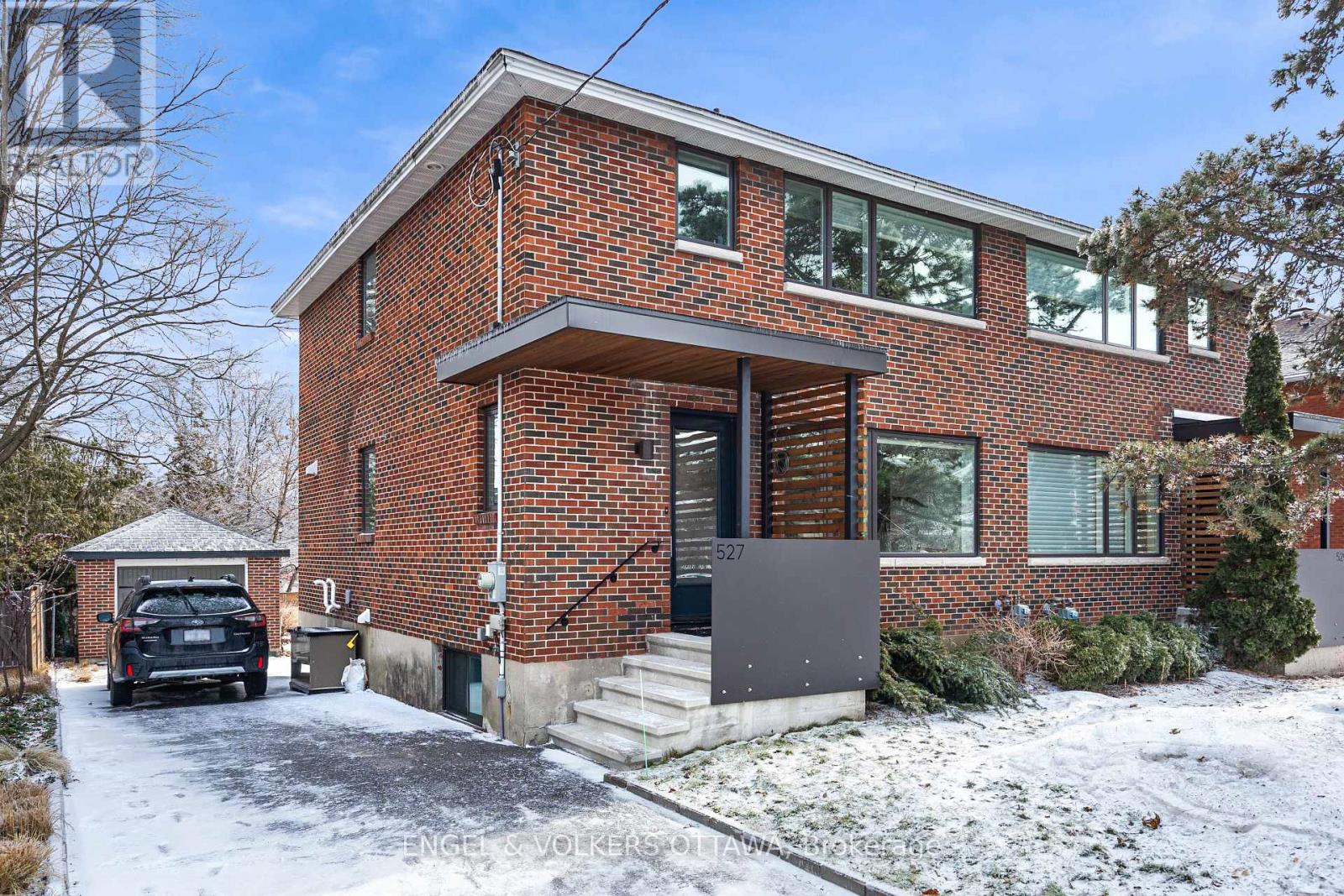Located on one of Westboro's most sought-after streets, 527 Evered Avenue offers outstanding curb appeal, a prime location, and a family-friendly setting. This 3+1 bedroom, 2 bathroom home was completely renovated in 2018, including new windows, electrical, plumbing, heating systems, and more, creating a bright, modern interior while maintaining the solid character of the home. The main level features warm hardwood floors, generous living spaces, and a well-appointed kitchen with modern cabinetry and an island overlooking the dining area. Upstairs offers three comfortable bedrooms, while the additional lower-level bedroom provides flexibility for guests, a home office, or additional family space. The backyard is a standout feature, backing directly onto Clare Gardens Park with no rear neighbours, offering privacy and a peaceful green backdrop. A detached garage with a newer roof (approx. 2020) and parking for up to four vehicles in the laneway adds rare convenience in this prime Westboro location. Just steps to the vibrant shops and restaurants of Richmond Road - including Lexington Smokehouse, Gezellig, and MEC - and close to excellent schools such as Nepean HS, Notre Dame HS, and Hilson Ave PS, with quick access to the highway for an easy commute.A fantastic opportunity to live on one of Westboro's most desirable streets. (id:48254)
