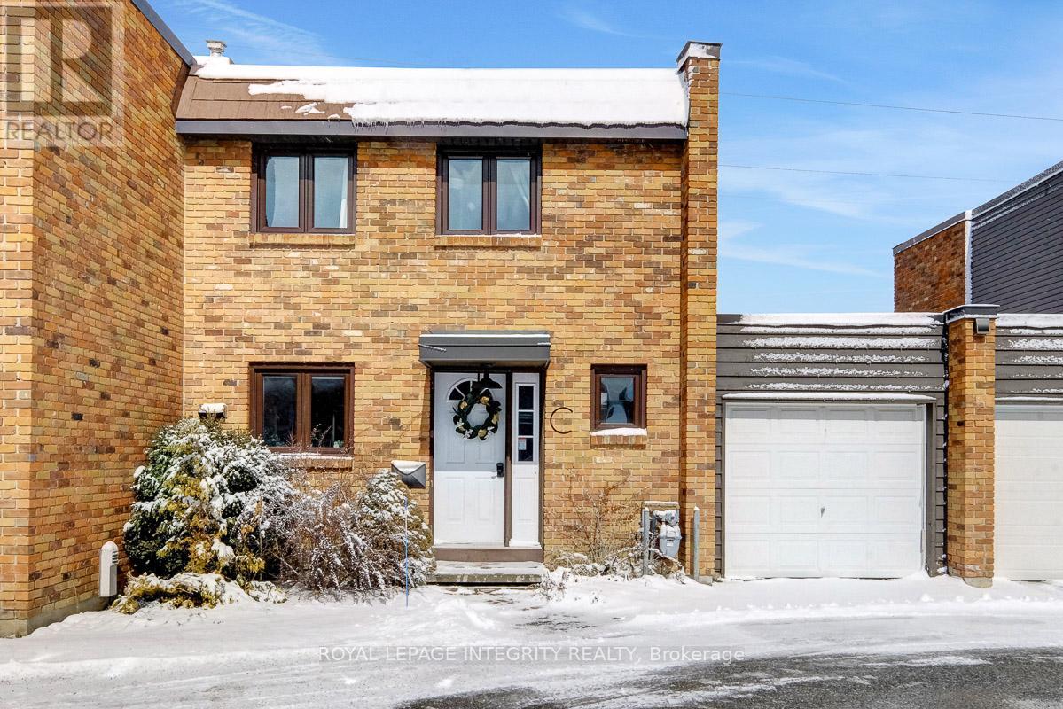 Open House Sunday March 22nd 2:00PM to 4:00PM. Welcome to this beautifully updated condo town home tucked into a quiet corner of Bells Corners, backing onto peaceful green space with no rear neighbours. Offering privacy, thoughtful updates, and a bright open layout, this home delivers comfortable living in a convenient and family-friendly location close to parks, transit, shopping, and major commuter routes.The main floor welcomes you with an inviting foyer and mudroom area with inside access to the single attached garage. Warm hardwood and laminate flooring flow throughout the thoughtfully designed living space, where a bright open-concept layout connects the living room, dining area, and a versatile additional space perfect for a home office, reading nook, or hobby area.The kitchen has been tastefully updated with crisp white cabinetry, a classic subway tile back splash, dark counter tops, and upgraded appliances (2019), creating a functional and stylish space for everyday cooking and entertaining. Upstairs, you'll find three comfortable bedrooms including a generous primary bedroom with ample closet space, along with a beautifully renovated full bathroom (2020) featuring modern finishes.The finished basement (2020) offers additional flexible living space with laminate flooring, recessed lighting, and an industrial-style ceiling, making it ideal for a recreation room, gym, home office, or play area. The lower level also includes a well-organized laundry and utility area. Step outside to a semi-private backyard framed by mature hedges, offering a deck and green space perfect for relaxing, gardening, or enjoying the quiet natural setting behind the home. Located in Ottawa's established Bells Corners community, this property is close to schools, parks, walking and biking trails, shopping, and transit while still offering a peaceful setting surrounded by green space. (id:48254)