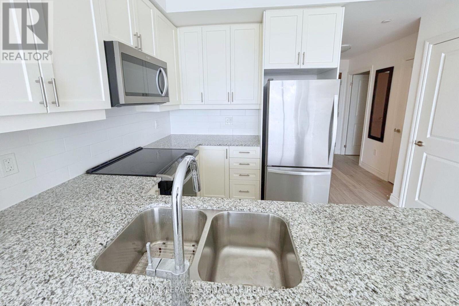 418 - 1050 Main Street E, Milton (De Dempsey), Ontario  L9T 9M3 - Photo 6 - W12896112