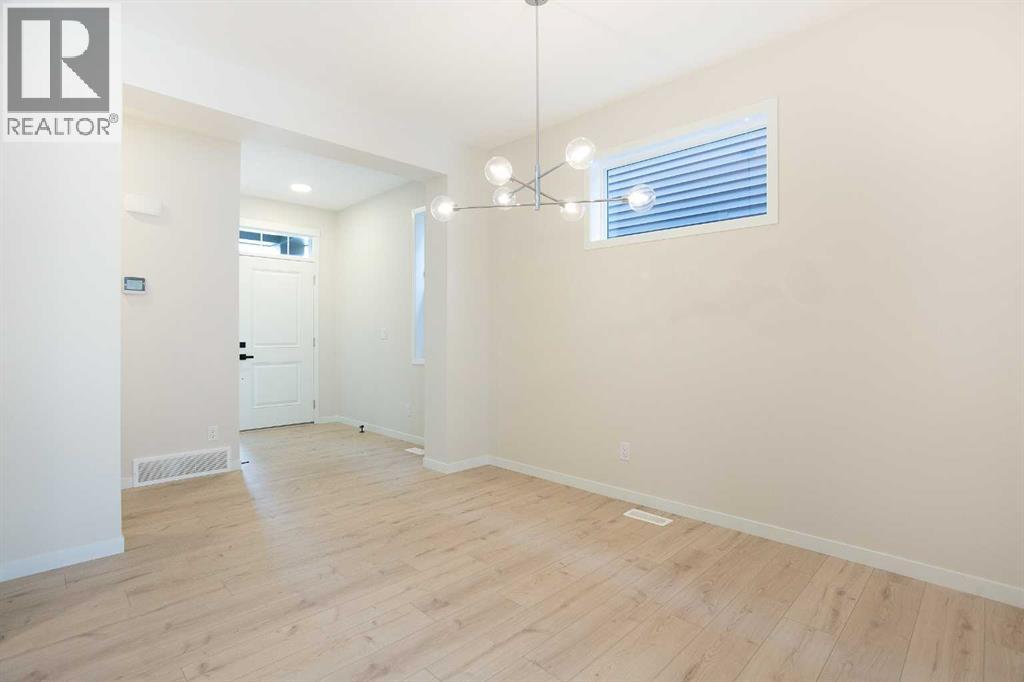 53 Creekside Passage SW, Calgary, Alberta  T2X 5V6 - Photo 3 - A2279223