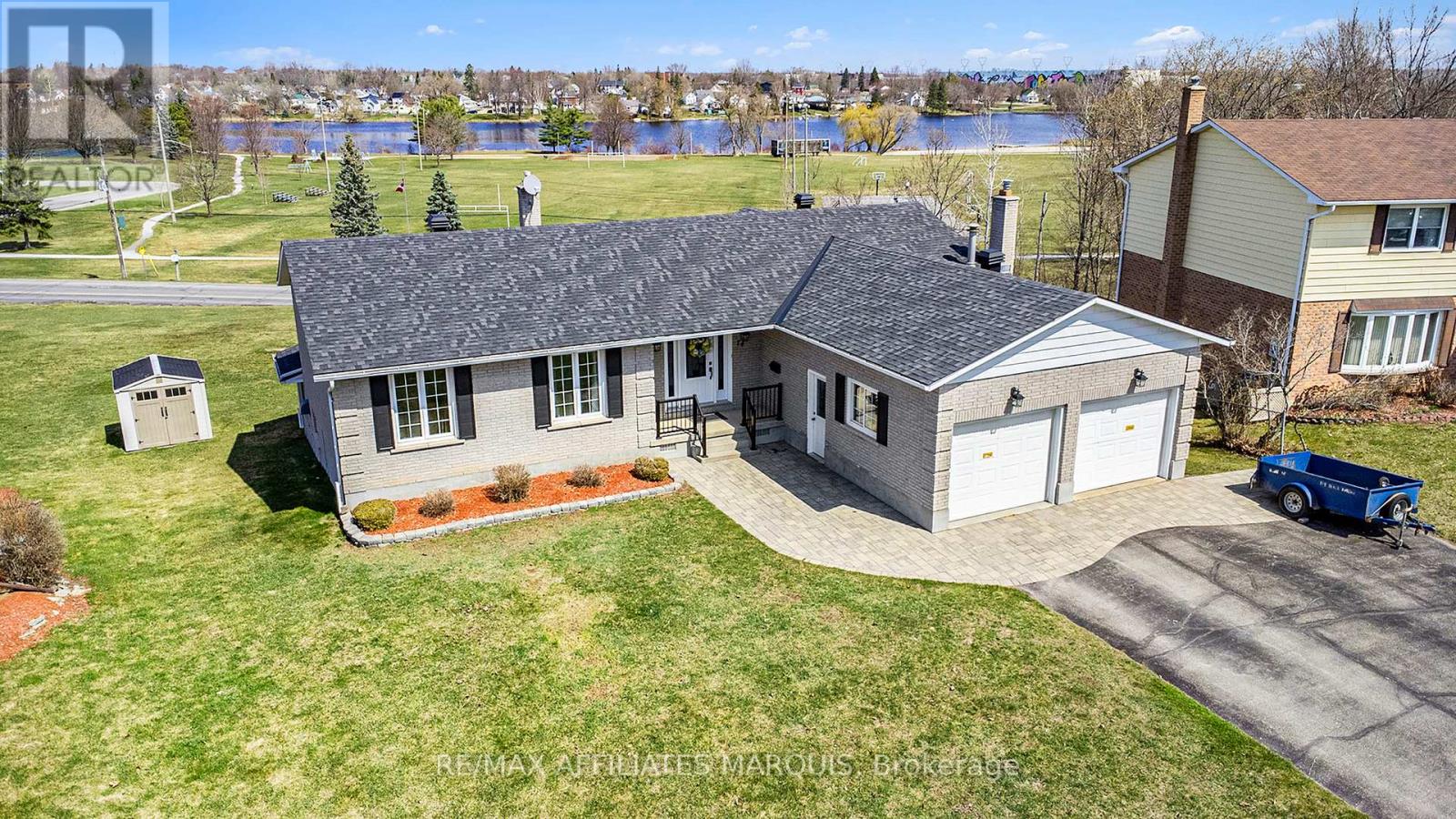 Every street has a premium lot location. This property has an unobstructed view of the Rideau River, parks and recreational areas. Enjoy a spectacular view of the Rideau River while sipping something fresh on your upper level screened in porch or ground level walk out patio. A large home quality built for the whole family by Galipeau Construction. Sitting on a choice walkout lot on the prestigious Colonel By Crescent. A well-developed area of town with easy access to schools, parks, shopping & amenities. Boasting approximately 4000 sq ft of space, you're greeted by a wide foyer, a comfortable living rm, a formal dining rm, kitchen with breakfast bar & eating nook. There is an upper sunroom, a main floor Laundry & a mud room to the double car garage. Down the hall you'll find a 4 pc. Bathroom, a spacious master with ample closet space and 3 pc. ensuite, plus two more good sized bedrooms. The lower level offers more expansive space beginning with a walk-out family room with gas stove, a games area with a welcoming wet bar, a 4th bedroom, a 3 pc. Bathroom, a huge recreation room or split this one into an exercise rm & home office. (Note there is an existing decommissioned indoor pool under the rec room floor joists. It may be possible to restore it if desired) plus a large storage rm & utilities rm. Radiant Hot water heat + heat pump air conditioning. Large pie lot & parking for 6 on the paved triple car wide driveway. Water $1260, Hydro $1672, Gas $1752, Taxes 6593 (to be verified) (id:48254)