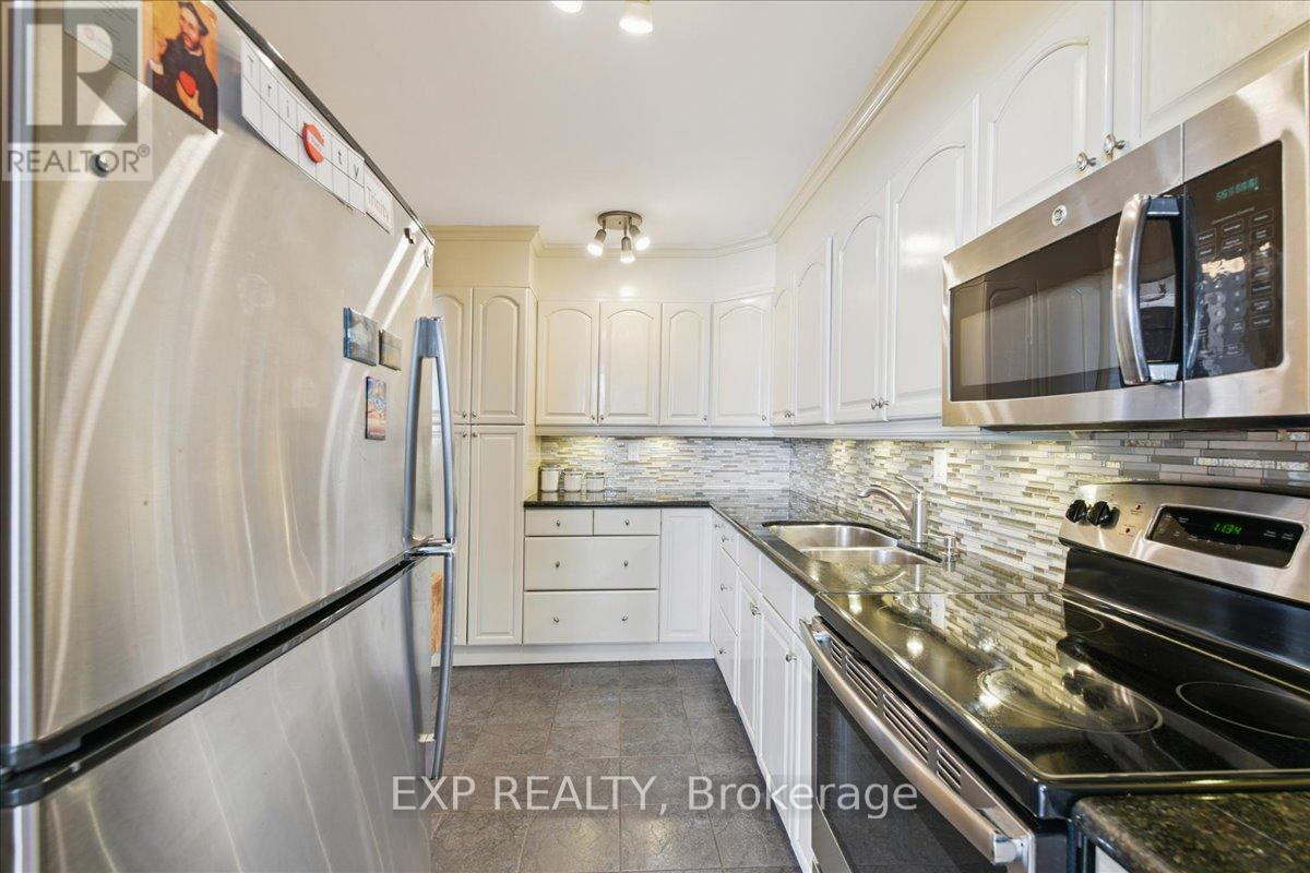 412 - 44 Longbourne Drive, Toronto (Willowridge-Martingrove-Richview), Ontario  M9R 2M7 - Photo 2 - W12840086