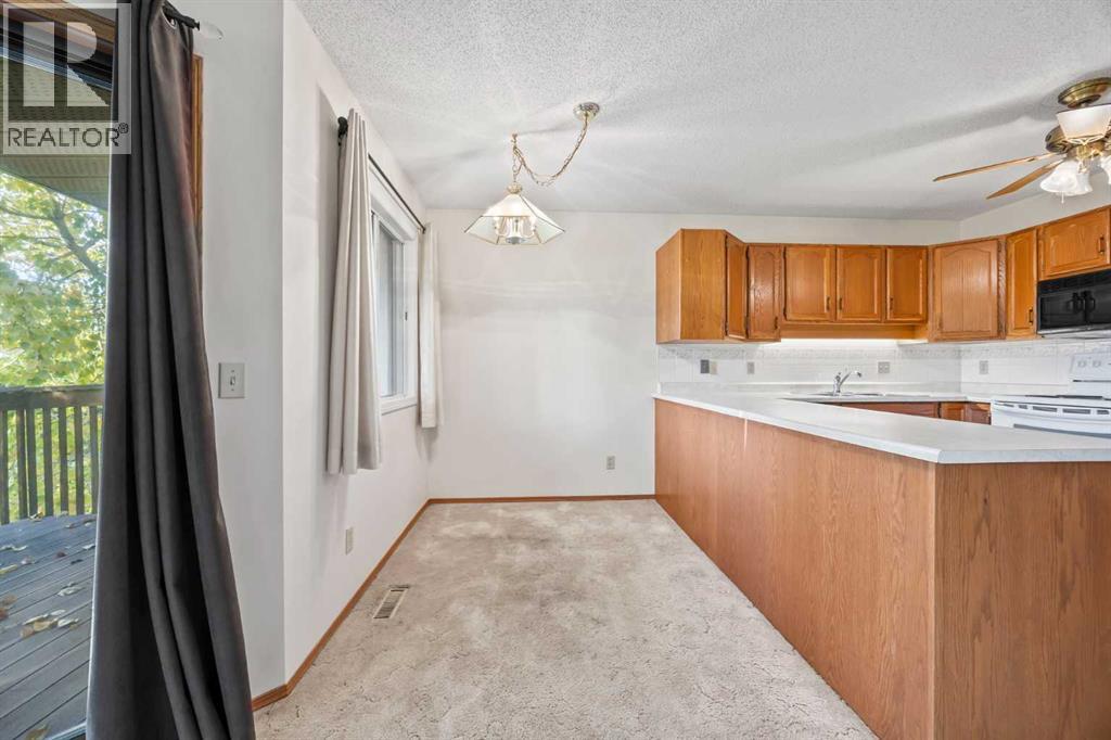 52 Sandarac Circle NW, Calgary, Alberta  T3K 3V6 - Photo 6 - A2263600