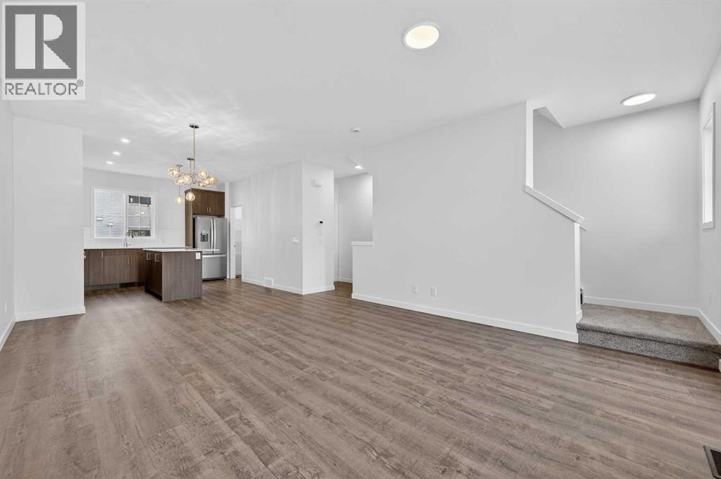 56 Creekside Drive SW, Calgary, Alberta  T2X 6E2 - Photo 3 - A2282815