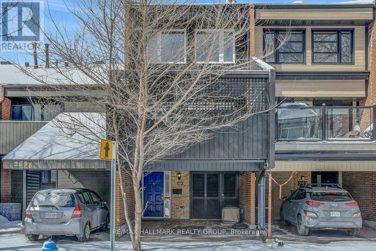 261 Bruyère St, 2bedroom + Den/Loft and 3 bathrooms, lies in a unique enclave of homes bordered by the Rideau River, King Edward Ave, and St Patrick Street. Minutes to Ottawa's Multi-Use Pathway System for running, cycling. Ten minute walk to Global Affairs. The home features hardwood floors in the living room, kitchen and dining areas. Loads of natural light permeates through.  Gorgeous kitchen with granite counters, plenty of cabinetry, recessed lighting. Access to fully-enclosed backyard. Home has multiple levels. Step-up to a formal, south-facing, living room with wood fireplace. Access to extra-large balcony/deck for entertaining. Hop to the primary bedroom with 3pc ensuite, double closets, followed by a second bedroom (south-facing) with vaulted ceilings and hardwood floors. Full bathroom off the hallway to the second bedroom.  Top level features large Loft/Den area with hardwood floors (could be converted into a third bedroom); useful as an office, reading space, general relaxation (has a bonus little nook). Lower level has laundry room and powder room. Large utility room also provides room for storage.  Home has two outdoor spaces (balcony/deck and backyard). Parking at front (carport). Close to many downtown amenities including the Byward Market, Sussex Dr, Rideau Centre, a short jaunt to Gatineau via King Edward and Macdonald-Cartier Bridge. Call today for a viewing! (id:48254)