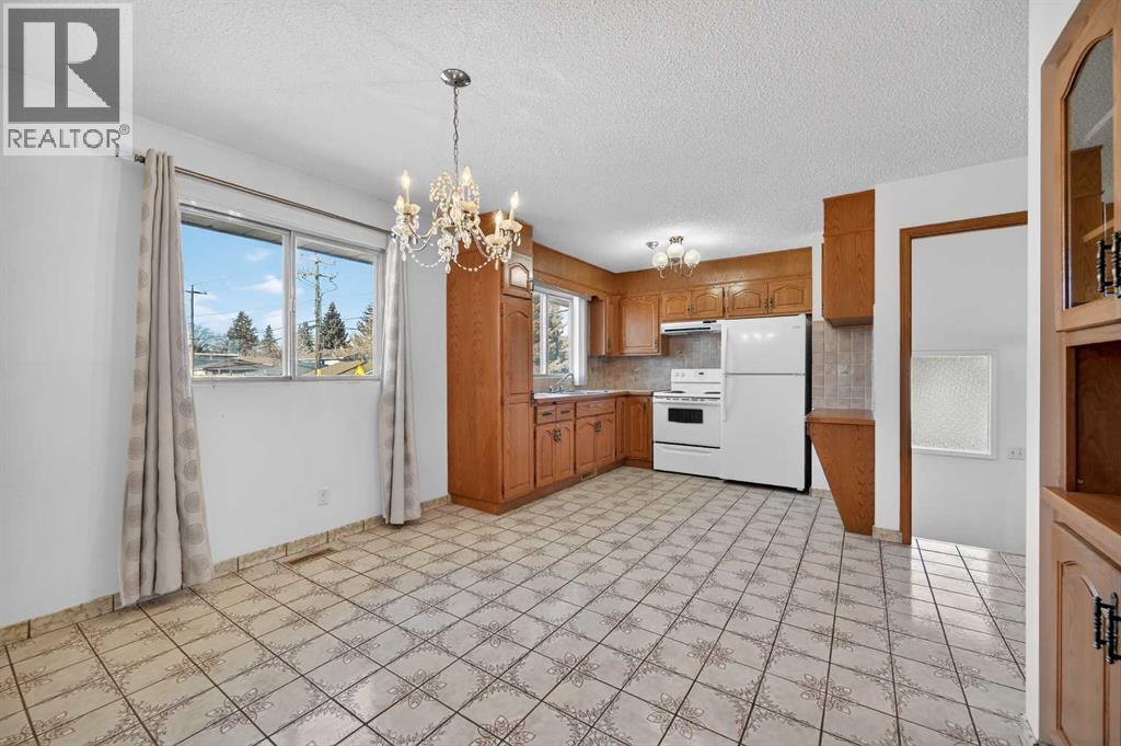 7228 Huntridge Hill Ne, Calgary, Alberta  T2K 4A5 - Photo 9 - A2289367