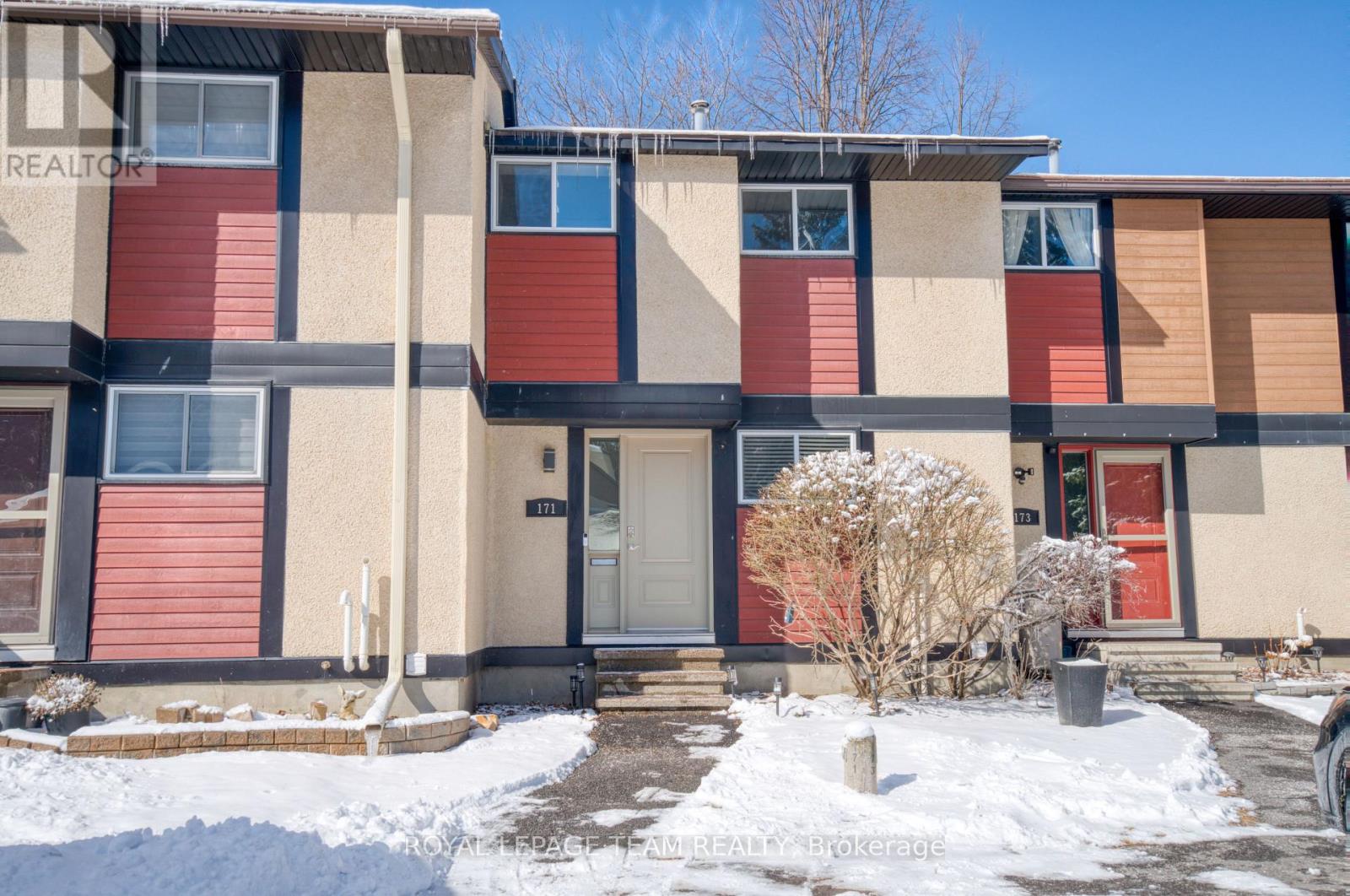 Welcome to this beautifully maintained 3-bedroom, 2-bath condo in the heart of Kanata, set within a highly sought-after mature neighbourhood known for its extensive pathways and family-friendly feel. Ideally positioned within the complex, this home offers a private driveway directly at your front door and backs onto a central greenspace-providing both convenience and privacy with no rear neighbours. The fully fenced backyard features low-maintenance turf, perfect for easy outdoor living. Inside, you'll find a home that has been well cared for, with thoughtful updates including a refreshed kitchen and bathrooms, hardwood flooring on the main level and upper hallway, and newer carpet in the remaining areas. The bright, open-concept living and dining space overlooks the backyard and mature trees, creating a comfortable and inviting setting. Upstairs offers a spacious primary bedroom with a huge closet, along with two well-sized secondary bedrooms and a full bath. The lower level adds valuable living space with a cozy family room and convenient powder room. Walkable to schools, the Kanata Leisure Centre, Centrum shopping, and transit including the Park & Ride, with quick access to the 417, this is a fantastic opportunity for first-time buyers, downsizers, or investors alike. (id:48254)