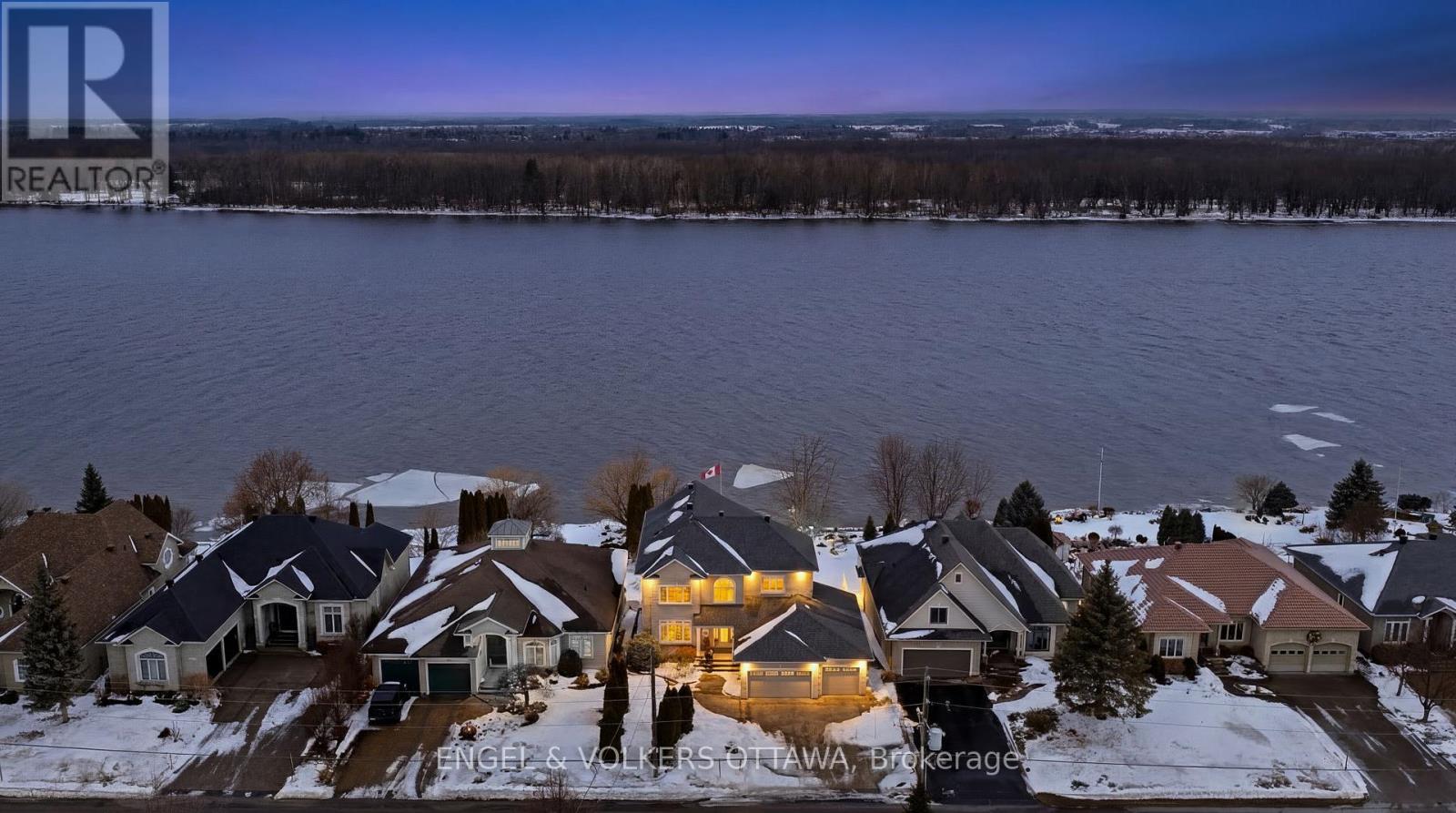 Set along the serene shores of the Ottawa River, this exceptional waterfront residence offers a rare blend of elegance, comfort and thoughtfully designed living. Professionally landscaped grounds create stunning curb appeal and a picturesque setting that complements the home's natural surroundings. Inside, rich oak hardwood floors flow throughout the main living areas, enhancing the warm and refined atmosphere. The beautifully designed Laurysen kitchen is both stylish and functional, featuring quality cabinetry and a spacious walk-in pantry-perfect for everyday living and entertaining alike.The living space is anchored by a striking marble fireplace, creating an inviting focal point for gatherings or quiet evenings at home. For ultimate convenience, the home also includes a private elevator connecting multiple levels. Upstairs, the expansive primary suite offers a peaceful retreat with a luxurious ensuite designed for relaxation. Two additional bedrooms each feature their own private ensuite bathrooms, providing comfort and privacy for family members or guests. The walk-out basement extends the living space and includes a bathroom, making it ideal for entertaining, recreation or accommodating guests. From here, step outside and experience the true highlight of the property-your own waterfront oasis. With easy access to the river and beautifully maintained outdoor spaces, this home offers a lifestyle defined by tranquility, natural beauty and refined living. A rare opportunity to enjoy elegant waterfront living in an extraordinary setting. Some photos have been virtually staged. (id:48254)