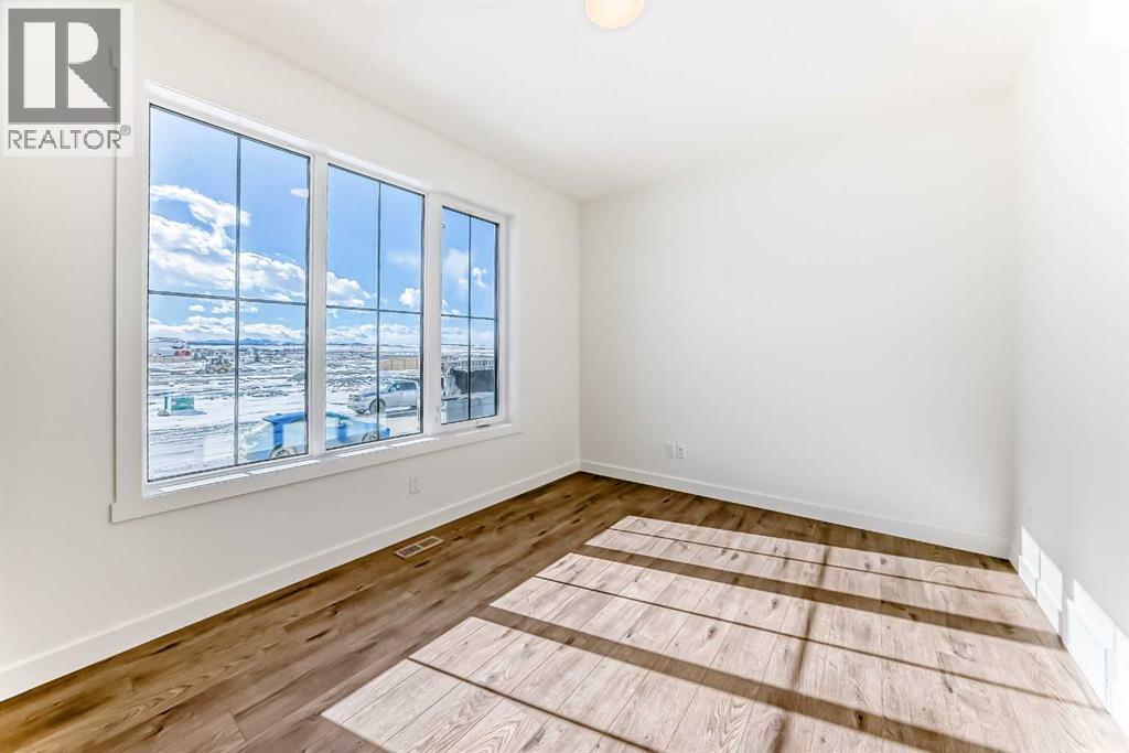 206 Harmony Circle, Rural Rocky View County, Alberta  T3Z 0H8 - Photo 11 - A2278050