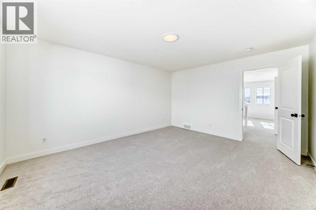 206 Harmony Circle, Rural Rocky View County, Alberta  T3Z 0H8 - Photo 16 - A2278050