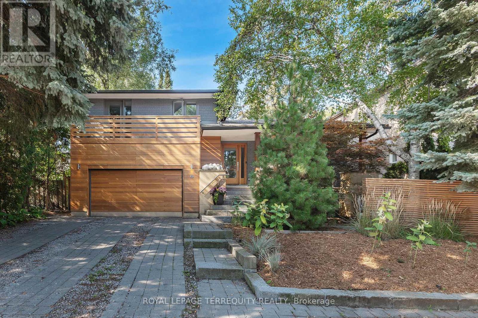 Mid-century modern sanctuary in the heart of the Kingsway, set on a rare private 50 x 150 ft park-like lot. Thoughtfully remodeled by a local architect, this home blends clean contemporary lines with the warmth and functionality of classic 1970s design. Step into a light-filled living and dining area anchored by a striking gas fireplace and oversized picture window overlooking the hard-landscaped front courtyard. The sleek kitchen with stainless steel appliances opens toward the expansive, west facing backyard, creating an effortless connection between cooking, dining, and outdoor living. An inviting tandem breakfast room flows into the ground-level family room, where a wood-burning fireplace and multiple walkouts make the garden feel like an extension of your living space. Upstairs, four generous bedrooms and two bathrooms, including a primary ensuite, offer plenty of room for a growing family. The finished lower level adds flexible space, currently configured as an exercise and games area, with four-piece bathroom including jacuzzi tub, laundry cupboard, and the potential to create an additional bedroom. Storage is exceptional, with a massive crawl space, cold room, and a convenient double car garage with side by side driveway parking. Situated in the highly sought-after Lambton Kingsway School district, this home is steps to the school, park, playing field, winter toboggan hill, tennis courts, and city pool. Your children can comfortably leave the house at 8:15 a.m. and make the first bell. Enjoy weekend strolls to the Humber River Trail, nearby Lambton Mills Plaza, and easy access to two subway stations (Old Mill and Royal York). A rare combination of sustainability, privacy, and everyday convenience, this spacious Kingsway home is ready for you to move in and enjoy. (id:48254)