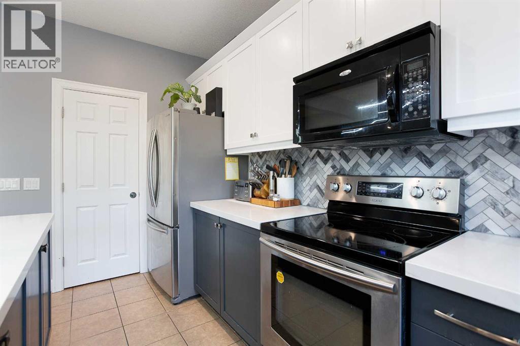 2016 Windsong Drive SW, Airdrie, Alberta  T4B 0P6 - Photo 4 - A2293326