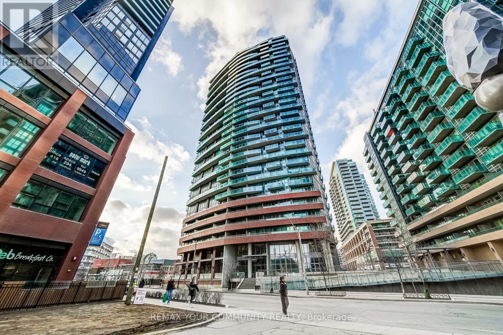 Welcome to a truly exceptional penthouse residence in the heart of Liberty Village. Spanning an impressive 2,694 square feet, this one-of-a-kind home is being offered for the first time by the original owner. Thoughtfully customized in collaboration with the builder, this residence delivers a rare opportunity to own a property of this caliber. Designed with entertaining in mind, the expansive open concept layout seamlessly blends the living, dining, breakfast, and chef's kitchen into one breathtaking space, featuring multiple walkouts to your private wraparound terrace with gas BBQ line. Floor to ceiling windows wrap the unit, showcasing spectacular 270 degree views to the North, South, and East. Enjoy uninterrupted vistas of Lake Ontario, the Toronto skyline, the CN Tower, Billy Bishop Airport, and BMO Field, home to upcoming FIFA World Cup matches. This luxurious penthouse features 2 plus 1 bedrooms and 3 beautifully appointed bathrooms. The primary suite is a private retreat, offering a spa inspired 5 piece ensuite with steam shower, three walk in closets, and direct access to the wraparound terrace. Wake up to iconic CN Tower views from the comfort of your own sanctuary. A spacious separate office provides the perfect work from home environment, while the second bedroom includes its own walk in closet and private 3 piece ensuite, ideal for guests or family. Additional highlights include two private entrances, two owned underground parking spaces, and two lockers conveniently located on the same floor. This is a rare offering that combines scale, customization, and iconic views in one unforgettable residence. A true showpiece for the most discerning buyer. (id:48254)