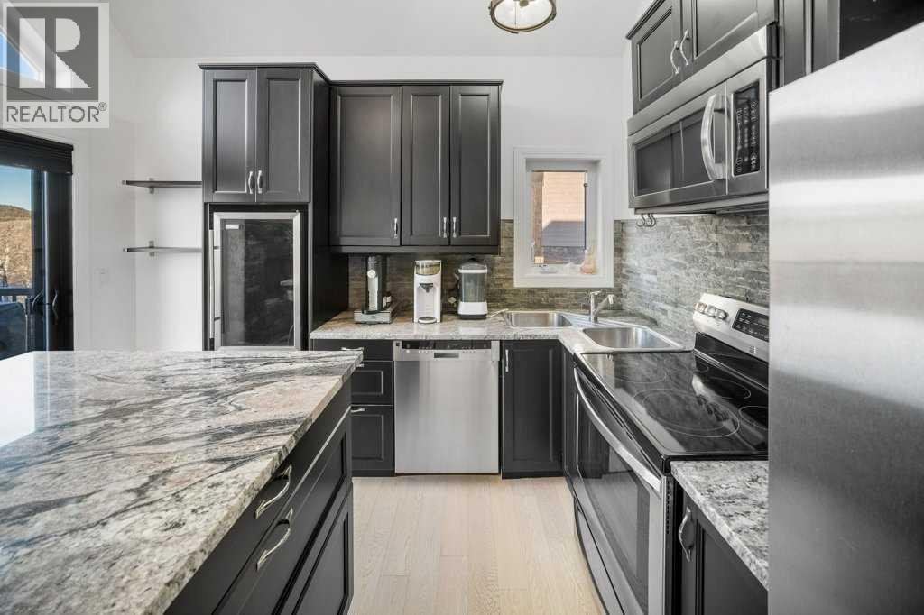 247 Cottageclub Crescent, Rural Rocky View County, Alberta  T4C 1B1 - Photo 7 - A2271474