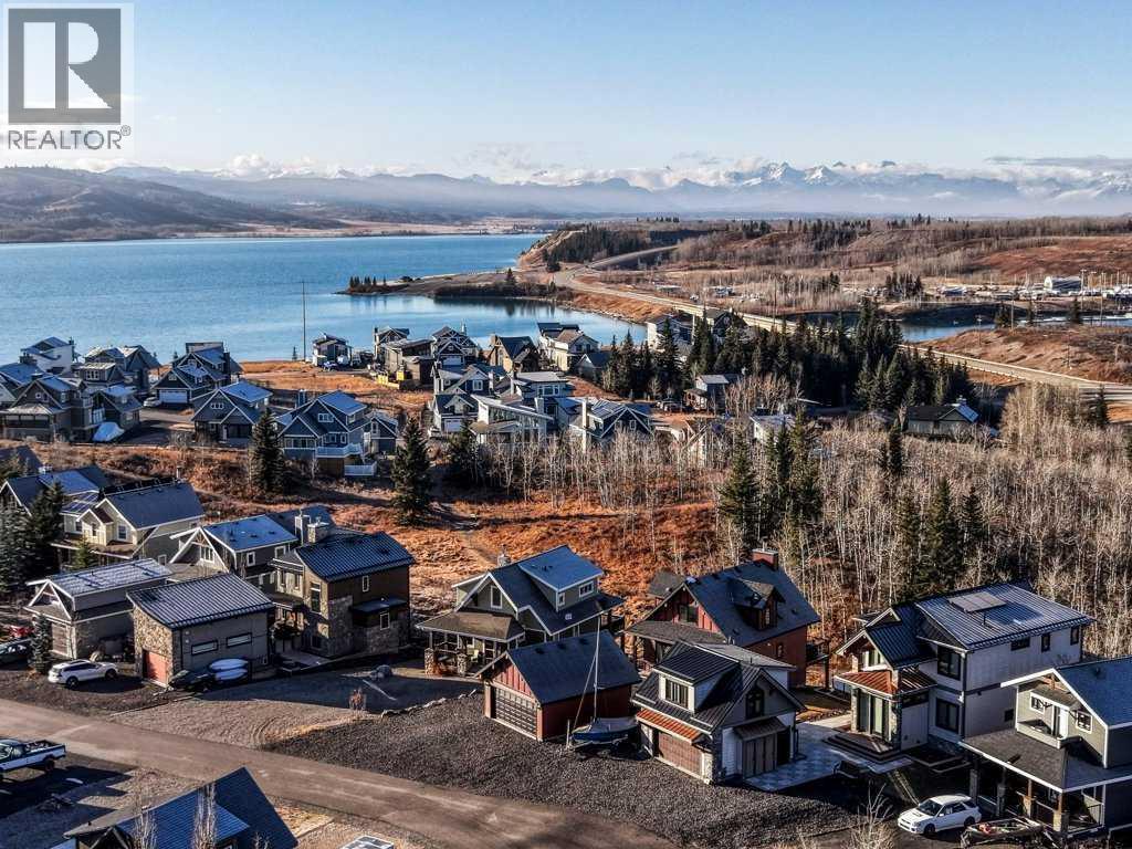 247 Cottageclub Crescent, Rural Rocky View County, Alberta  T4C 1B1 - Photo 4 - A2271474