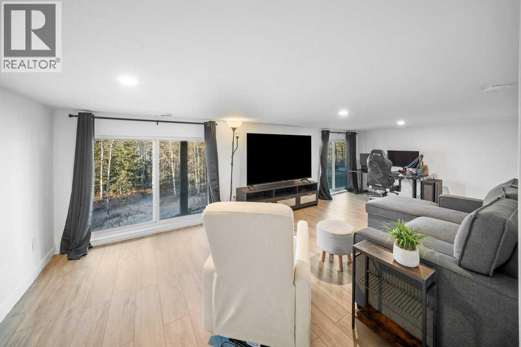 247 Cottageclub Crescent, Rural Rocky View County, Alberta  T4C 1B1 - Photo 30 - A2271474