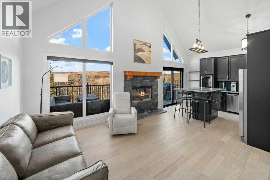 247 Cottageclub Crescent, Rural Rocky View County, Alberta  T4C 1B1 - Photo 10 - A2271474