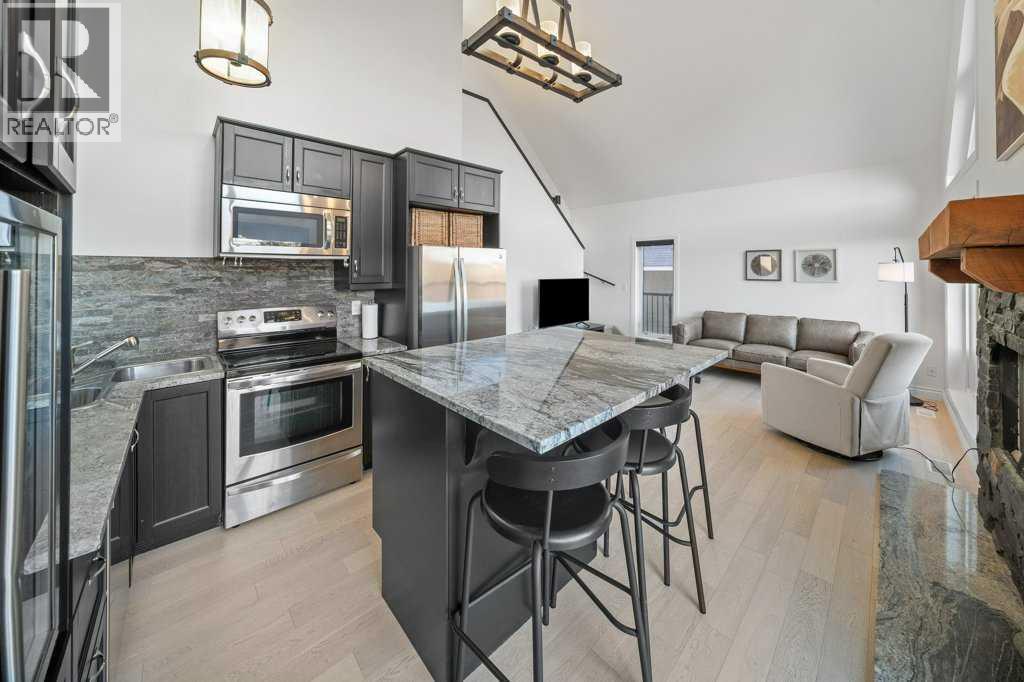 247 Cottageclub Crescent, Rural Rocky View County, Alberta  T4C 1B1 - Photo 6 - A2271474