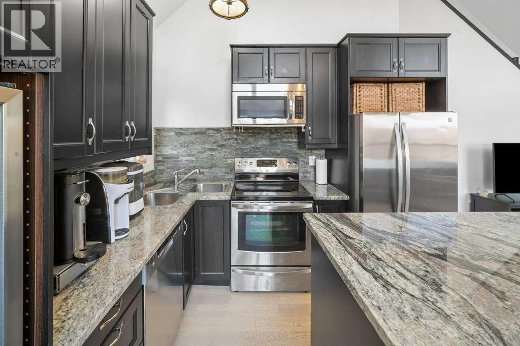 247 Cottageclub Crescent, Rural Rocky View County, Alberta  T4C 1B1 - Photo 13 - A2271474