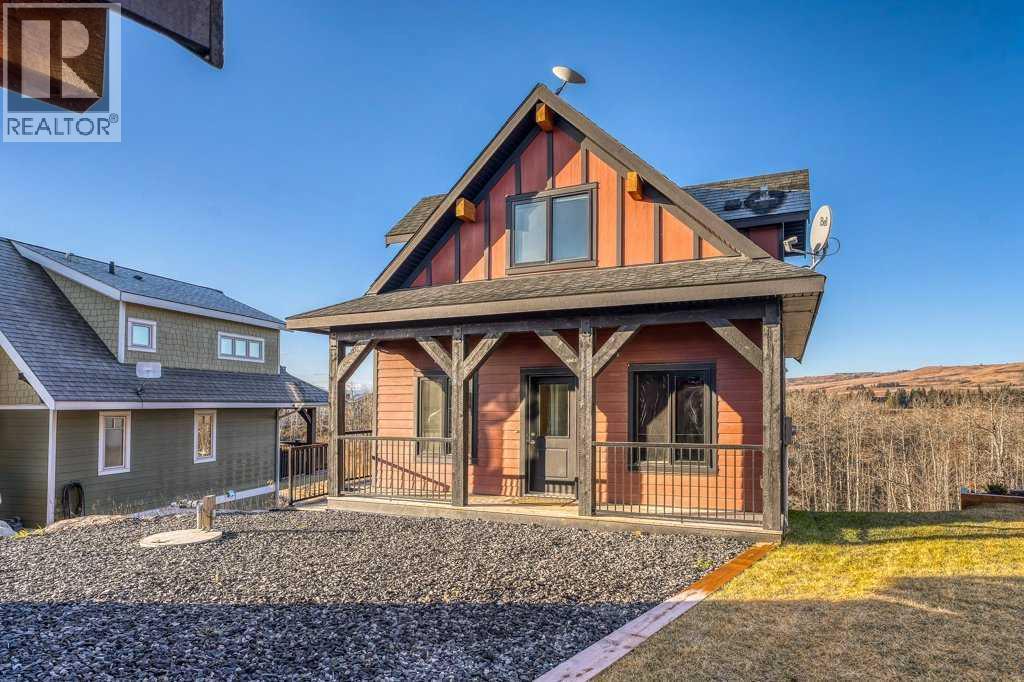 247 Cottageclub Crescent, Rural Rocky View County, Alberta  T4C 1B1 - Photo 2 - A2271474