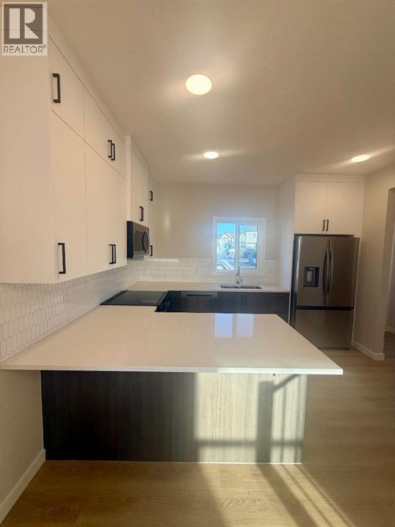 341 Ellen Park, Crossfield, Alberta  T0M 0S0 - Photo 6 - A2295058