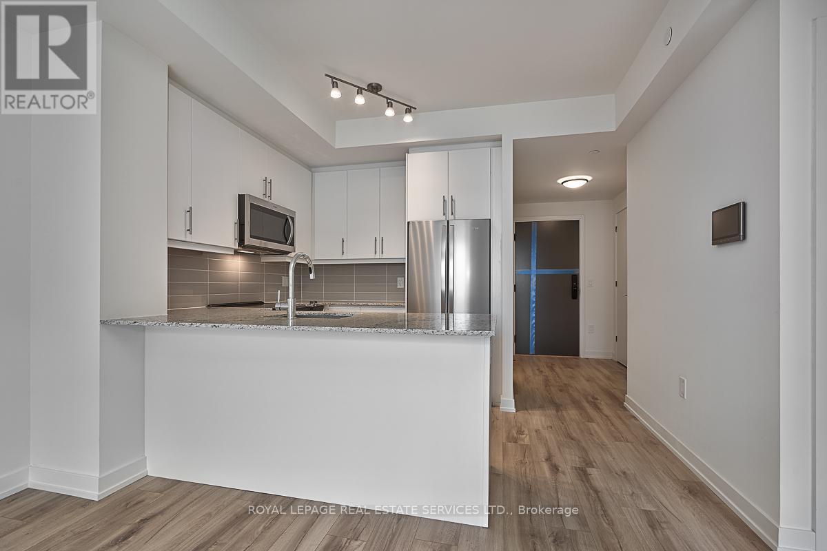 202 - 345 Wheat Boom Drive, Oakville, Ontario  L6H 7X4 - Photo 4 - W12916046