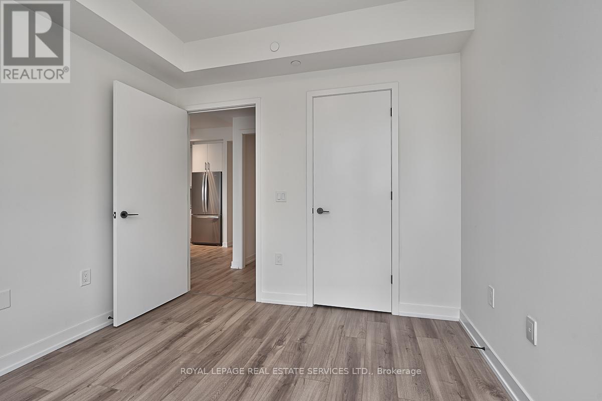 202 - 345 Wheat Boom Drive, Oakville, Ontario  L6H 7X4 - Photo 8 - W12916046