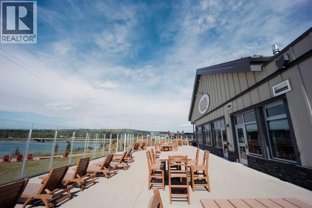 236 Cottage Club Crescent, Rural Rocky View County, Alberta  T4C 1B1 - Photo 6 - A2245247