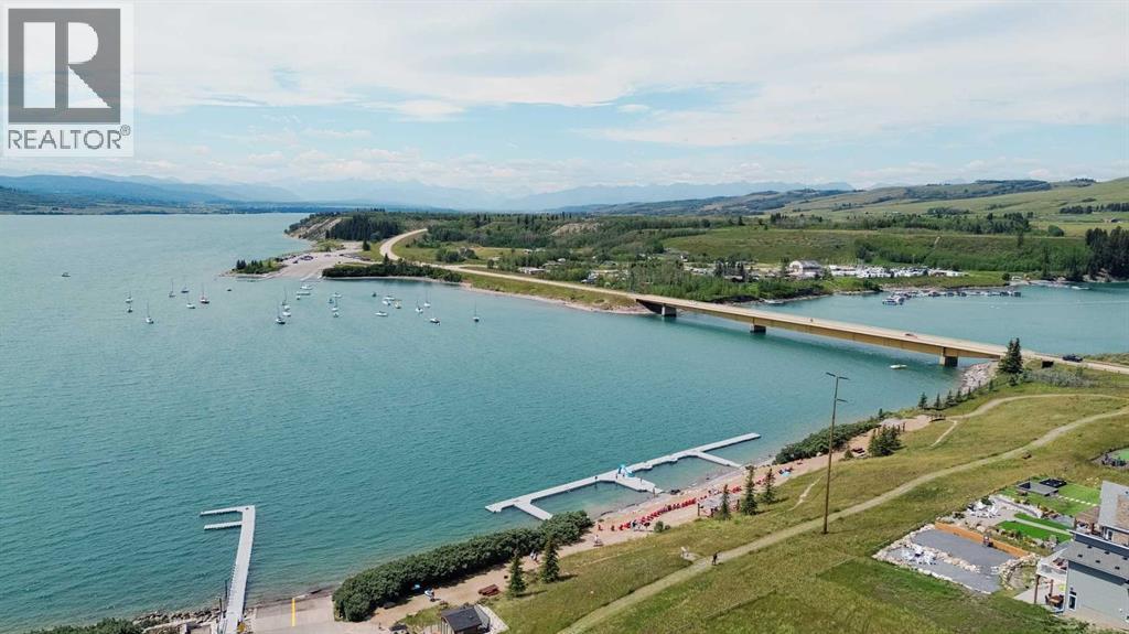 236 Cottage Club Crescent, Rural Rocky View County, Alberta  T4C 1B1 - Photo 2 - A2245247