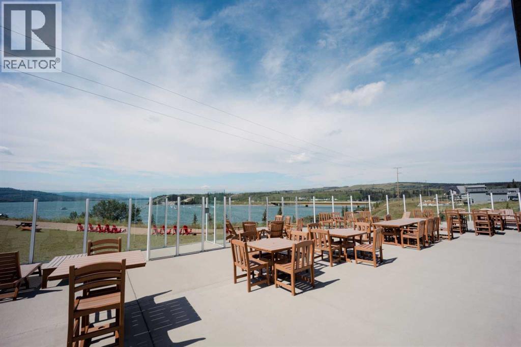 236 Cottage Club Crescent, Rural Rocky View County, Alberta  T4C 1B1 - Photo 7 - A2245247