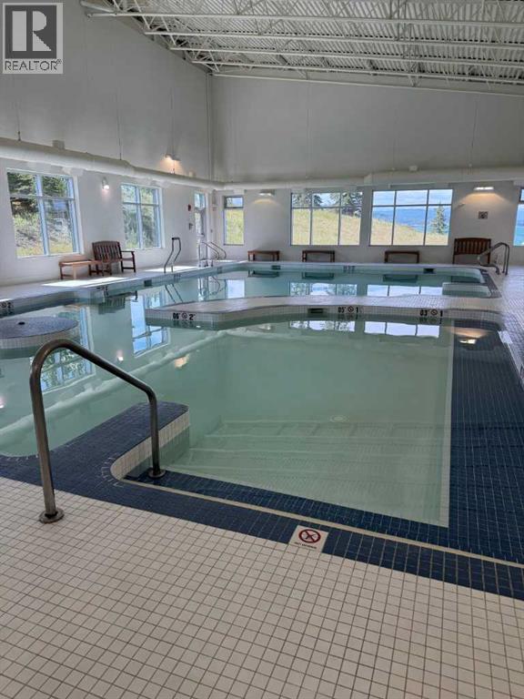 236 Cottage Club Crescent, Rural Rocky View County, Alberta  T4C 1B1 - Photo 13 - A2245247