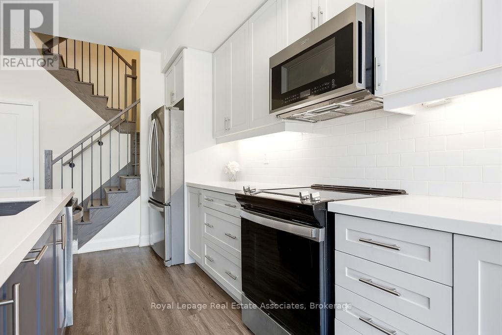 115 - 1569 Rose Way, Milton, Ontario  L9T 7E7 - Photo 2 - W12878058