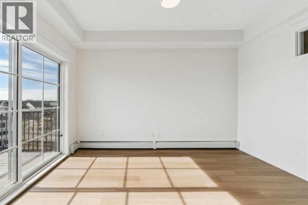 1403, 755 Copperpond Boulevard Se, Calgary, Alberta  T2Z 4R2 - Photo 7 - A2294286