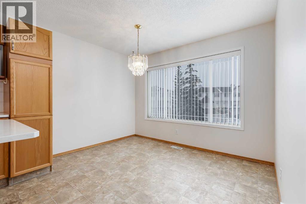 153 Rocky Ridge Court Nw, Calgary, Alberta  T3G 4S7 - Photo 11 - A2287379