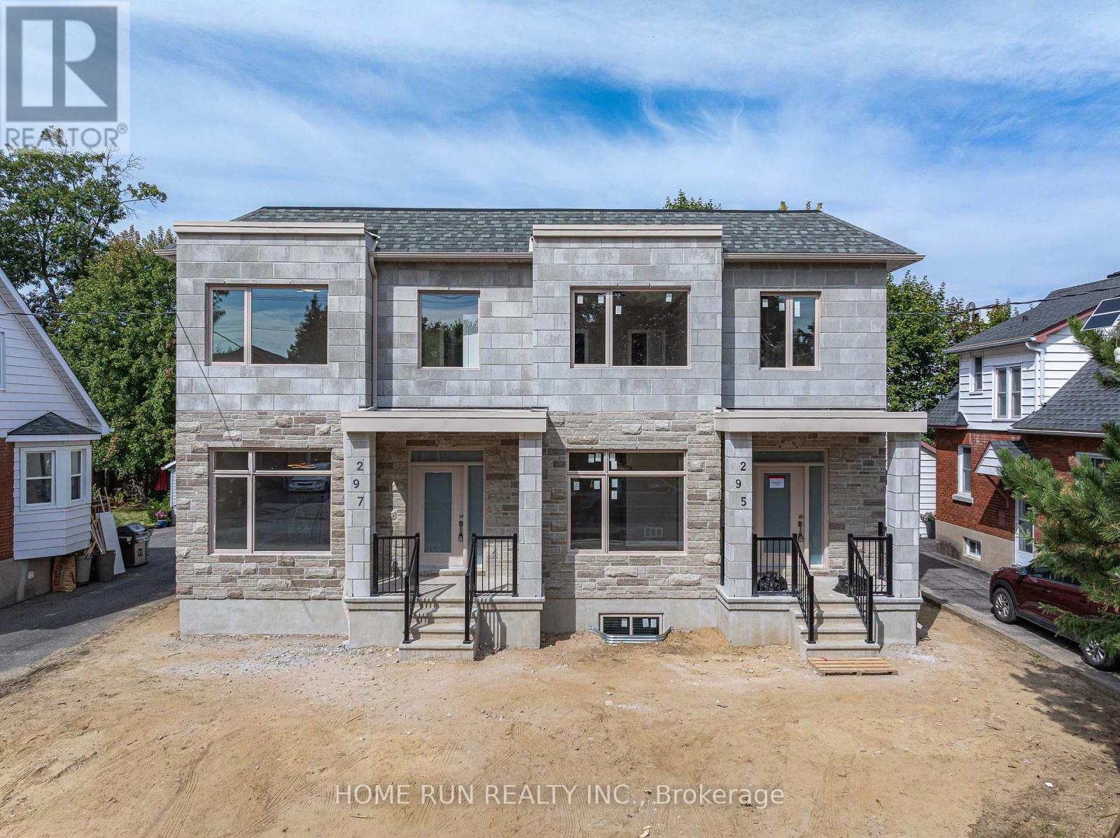 295 Dovercourt Avenue, Westboro - Brand New Semi-Detached home with SDU in the heart of Westboro offering over 2,700 sq ft of finished living space. The main and second floors feature 9-foot ceilings, 3 spacious bedrooms, and 3 bathrooms, including a primary suite with walk-in closet and luxury ensuite, complete with custom built-in shelving. Bright open-concept main level with skylight, a beautifully designed open office space, and an elegant living area. The chef-inspired kitchen features an oversized island, high-end cabinetry, and thoughtfully selected designer lighting throughout the home. Fully finished lower level includes a Secondary Dwelling Unit (SDU) with separate entrance, 2 bedrooms, bathroom, kitchenette, and living space-ideal for rental income or multi-generational living. Private and generously sized backyard offering a rare sense of space and privacy. Landscaping to be completed in spring. Prime location steps to shops, cafés, schools, parks, and transit. Covered by full Tarion Warranty. First-time home buyers may benefit from the newly introduced GST credit under Bill C-4, offering meaningful tax savings for eligible purchasers who have not owned a home in the past four years. As per the newly enacted zoning by-law, a front yard single driveway is permitted. (id:48254)