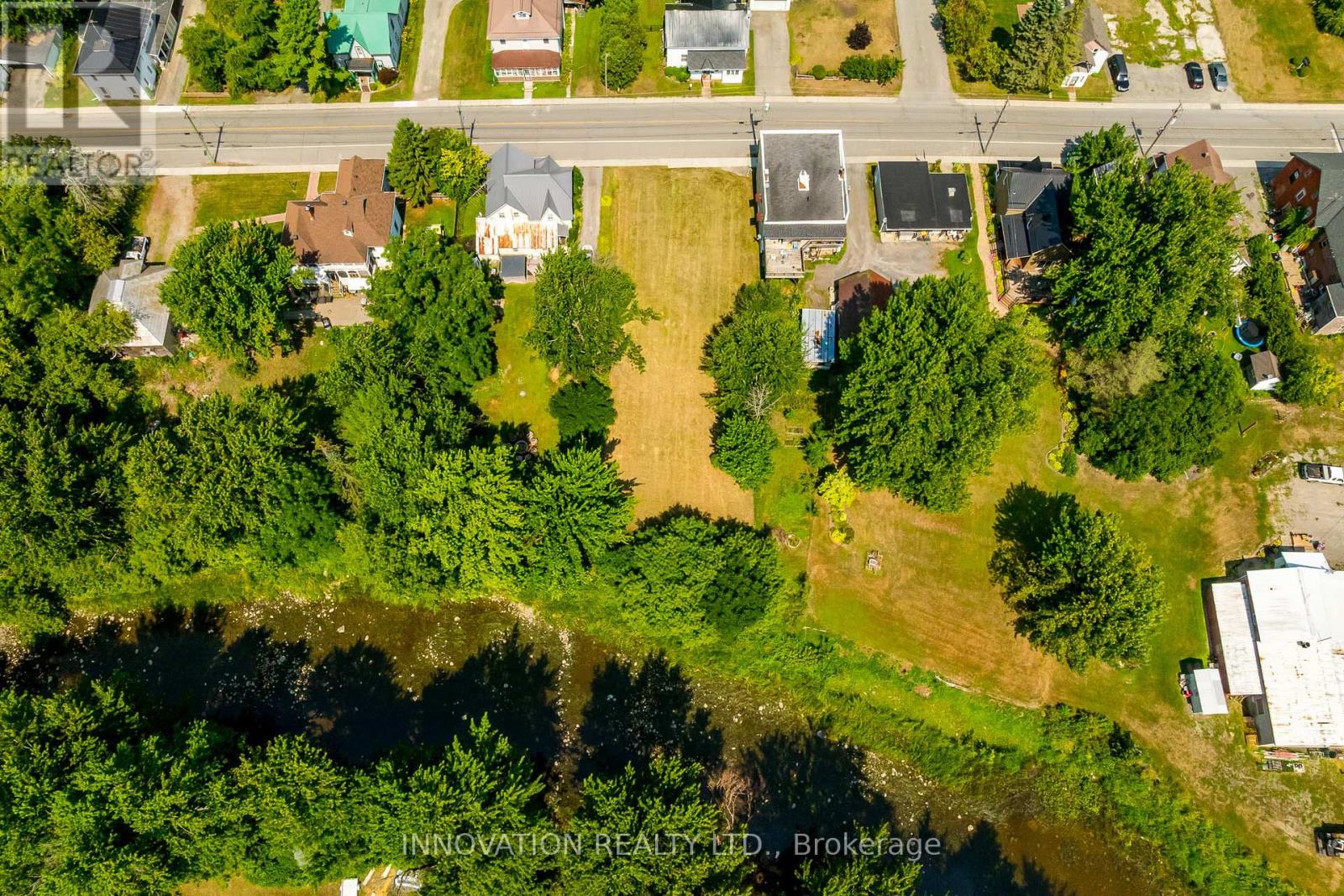 Discover the perfect place to create your dream home in the picturesque country village of Mountain. This beautiful building lot backs directly onto the tranquil South Nation River, offering a serene backdrop and endless opportunities to enjoy nature right in your backyard. Located in a welcoming community, this property is just minutes from the local school and a nearby golf course, making it ideal for families and outdoor enthusiasts alike. With its peaceful setting and convenient access to amenities, this lot provides the best of both worlds  country charm and everyday convenience Don't miss your chance to build the home you've always envisioned on this stunning riverside property! Slope stability assessment, Survey, Septic plan and more available. (id:48254)