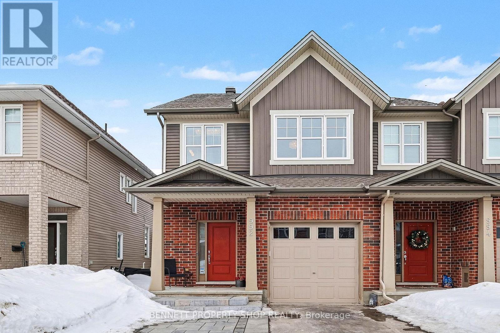 This Wonderful Tartan Built 3 Bed 3 Bath Topaz Model End Unit Townhome has over 1700 sq ft of finished space and is move-in ready in Family Friendly Findlay Creek. A community with expansive greenspace - nature trails, parks, great schools and endless ammenities.  This bright and meticulously cared-for home has all the contemporary finishings you would want in a newer home with more in upgrades. Great Curb appeal! At first look you will notice the tasteful interlocked walkway -step professionally designed to expand the parking for 3 cars- 2 side by side on the driveway plus 1 garage parking-inside foyer access. The property is fully fenced with side gate and generous interlock patio with new stairs - railings to access for entertaining and family fun. The main tiled foyer is functional with a large coat closet and 2 piece bathroom. This home is well layed out for maximum interaction with family and friends. Main floor 9 ft ceilings - creates an Airy and Open area with large windows, patio doors and continuous well-presented neutral hardwood floors. Kitchen features Crisp Arctic White Cabinetry that extends to ceiling for an abundance of storage plus Sit up Island. Granite countertops and a stylish, upgraded backsplash complete the look. The Principle bedroom has a generous 4-piece ensuite with upgraded granite countertops, spa soaker tub and glass shower with upgraded tiled wall plus walk in Closet. 2 nicely sized bedrooms with double closets and room to hang out. The shared bathroom with tub and shower is generous with lots of storage. The bright finished lower level has a cozy gas fireplace with realstone facade and oversized EGRESS windows plus a laundry area with rough-in for future bathroom. You will appreciate how well-maintained this home is. Recently Painted, Vents and Ducts cleaned, Carpets cleaned 2026, New Stove & Dishwasher and more. Everything has been regularly serviced.  Bring your discerning buyers - they will be impressed. 24 HR Irrevocable Offers (id:48254)