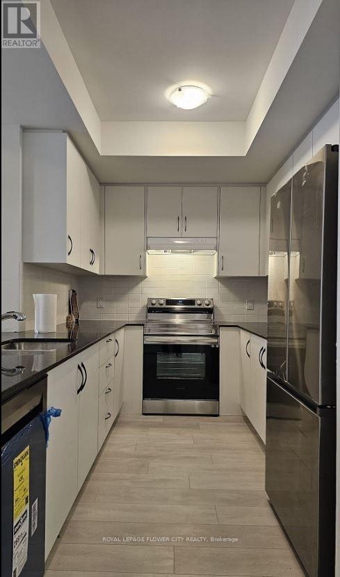 52 - 70 Knotsberry Circle, Brampton, Ontario  L7A 0S2 - Photo 4 - W12926694