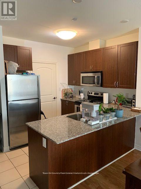 421 - 383 Main Street E, Milton, Ontario  L9T 8K8 - Photo 2 - W12927738