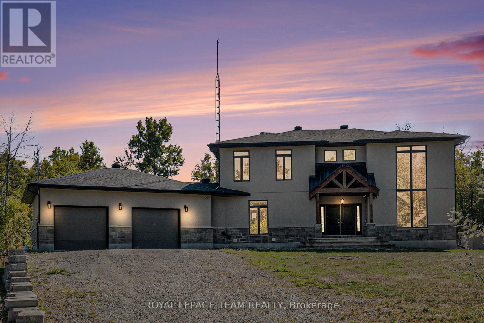 Discover the perfect blend of luxury and privacy with this impressive 4-bedroom, 3-bath home set on almost 9 acres of land. From the moment you step inside, the open-concept main level welcomes you with gleaming hardwood floors and abundant natural light. The spacious living area flows seamlessly to your expansive back deck, ideal for entertaining or simply enjoying the peaceful surroundings. The heart of the home is the chef's dream kitchen, featuring granite countertops, a large island, custom-built cabinetry, stainless steel appliances, and a spacious walk-in pantry. A mudroom with sink and direct access from the oversized double garage adds both convenience and practicality. Upstairs, retreat to the luxurious primary suite, complete with a spa-like ensuite and a generous walk-in closet. Two additional bedrooms, a 4-piece bath, and a large laundry room complete the second level. The finished basement expands your living space with a large family room, an additional bedroom, and a versatile den, perfect for a home office or cinema room. Step outside to your private backyard oasis. With no rear neighbours, you'll enjoy a large deck and an inviting pool surrounded by nature. This remarkable property offers both the space and lifestyle you've been dreaming of, all within reach of modern comforts. (id:48254)