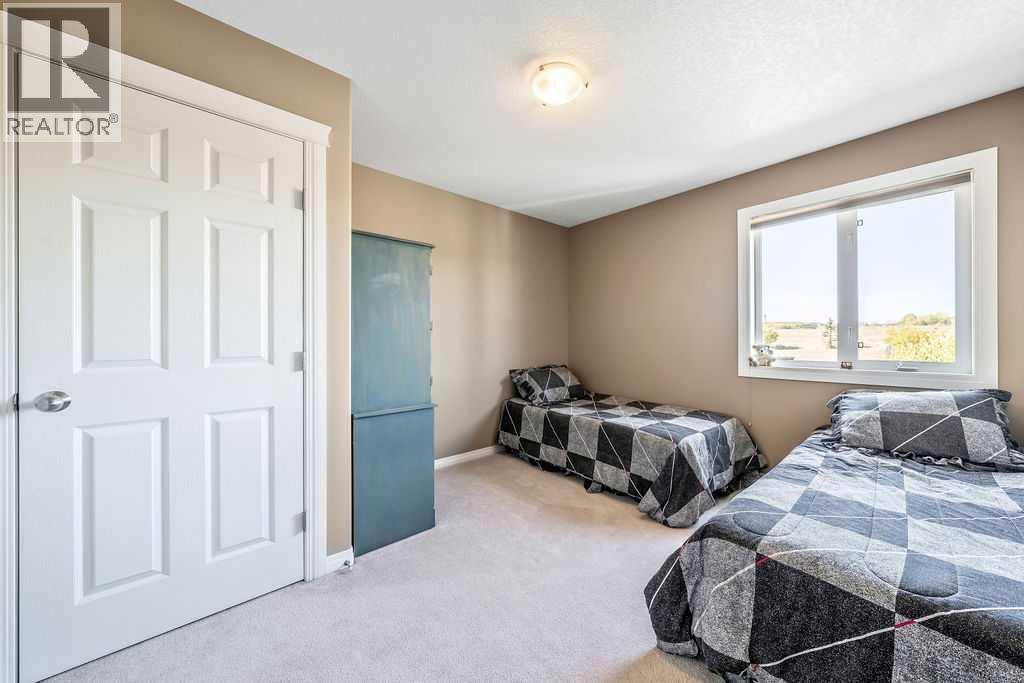 51 Norris Coulee Trail, De Winton, Alberta  T1S 5A5 - Photo 31 - A2267806