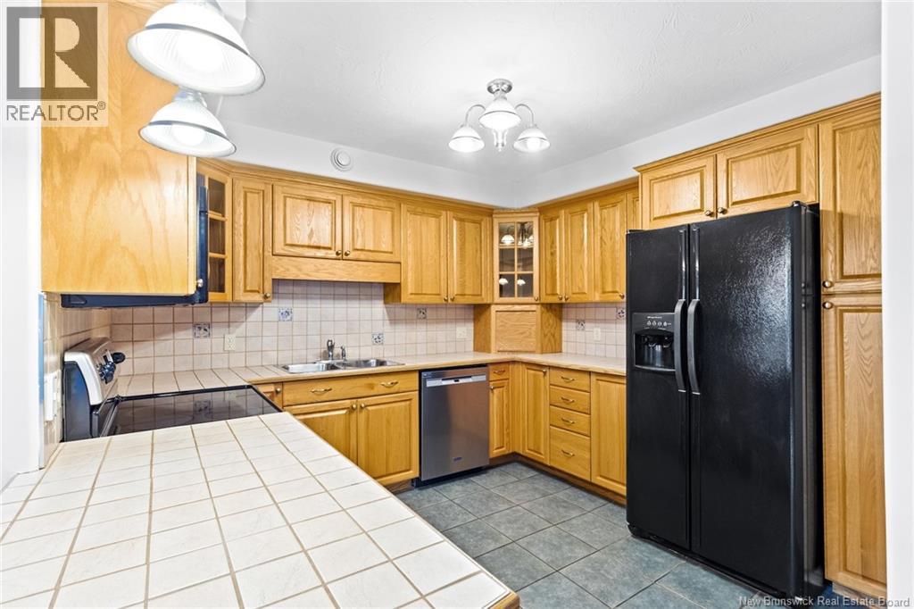 1 Golf Greens Lane Unit# 409, Fredericton, New Brunswick  E3B 9T9 - Photo 22 - NB136037